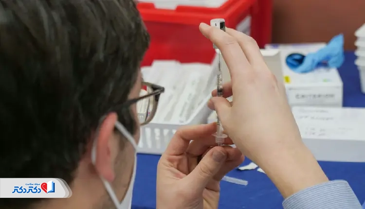 A healthcare professional prepares a syringe in a clinical setting, representing the type of environment where an MCH test may be conducted to evaluate hemoglobin levels in red blood cells